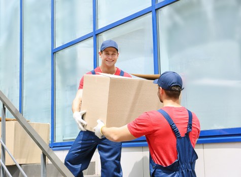Team organising a commercial relocation with labels and careful loading