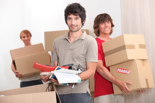 Careful unloading of household items at a London home