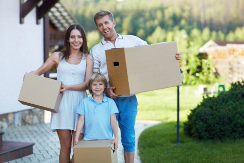 House movers handling a residential relocation in a London street with tight access