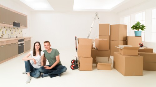 Mover wearing PPE while protecting items and property