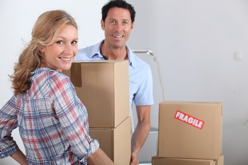 Careful furniture moving through a London home with stairs and narrow access