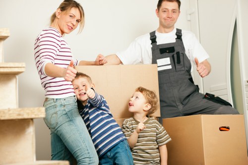 Unpacking boxes in a London apartment after relocation